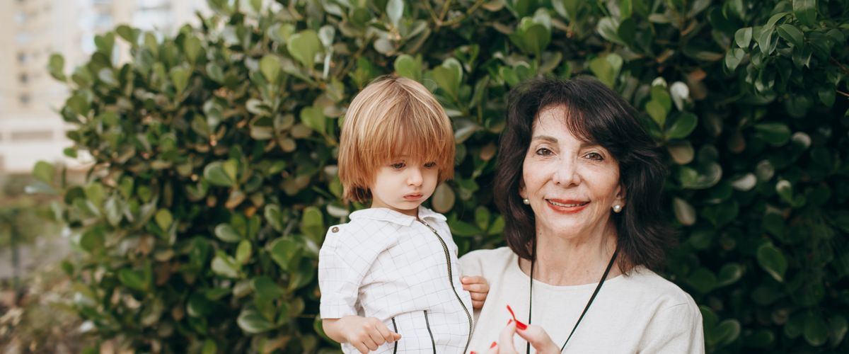 A grandmother walking with her grandchild